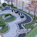 Modern Garden Landscape With Winding Pathway Lush Lawn Rock Decorations And Cherry Blossom Trees
