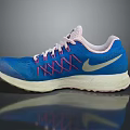 Blue Running Shoes With Pink Laces And White Nike Logo On Beige Sole