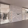 Stylish Clothing Store Window Display With Mannequin And Hanging Clothes On Racks