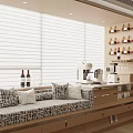 Modern Bay Window With Upholstered Seat Patterned Cushions Wine Bottles Cat Coffee Machine And Blinds