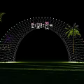 Night View Of Illuminated Decorative Arch With Sunrise Sign And Palm Trees