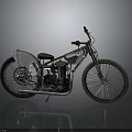 Vintage Motorcycle With Silver Body Black Seat Spoked Wheels And Metallic Finish On Reflective Surface