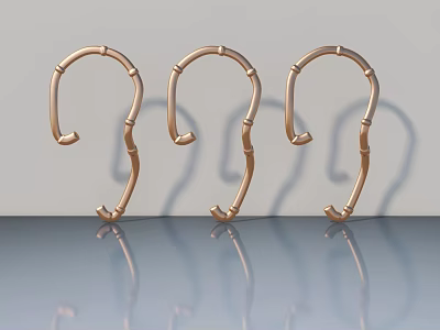 Three Copper Colored Bamboo Shaped Swing Door Handles On Gray Background With Reflections 3d model