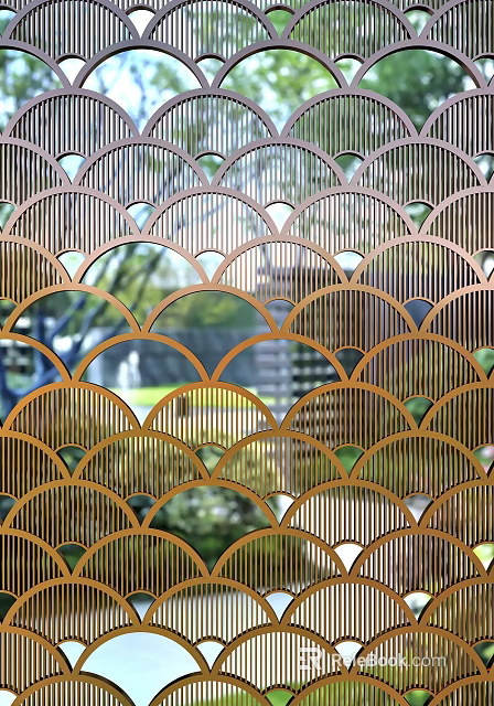 Decorative Golden Metal Room Divider With Scalloped Perforated Pattern Offering View Of Green Garden Scenery 3d model 