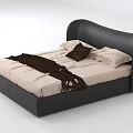 Double Bed with Black Curved Headboard Light Colored Mattress White Pillows Brown Cushion and Blanket
