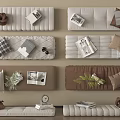 Neutral Colored Soft Pads Featuring Pillows Magazines And Green Plants