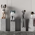 Modern Artistic Sculptures Displayed on Concrete Pedestals with Diverse Figurine Designs