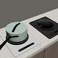 White And Black Induction Cooktops With Pot On Kitchen Counter And Wooden Cabinets