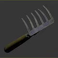 Garden Rake With Yellow Wooden Handle And Metal Tines Showing Reflection On Black Background