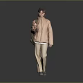 Woman In Light Pink Jacket And Beige Pants With Backpack On Gray Background