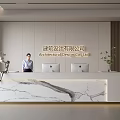 Modern Front Desk Reception With Marble Countertop Computer Monitors And Green Plants