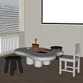 White Children's Table With Unique Shape Black Stools White Chair Colorful Drawing Potted Plant
