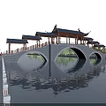 Traditional Chinese Arched Bridge Featuring Pavilions Over Water With Green Trees And Blue Sky