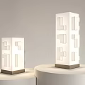 Modern White Table Lamps With Geometric Cut Out Design Dark Base On White Pedestals