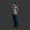 Man In Striped Sweater And Blue Jeans Gesturing Against Gray Background