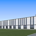 Modern Industrial Factory Building Exterior With Glass Windows White Walls Green Lawn And Blue Sky