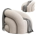 Plush Beige Single Sofa With Curved Design And Herringbone Throw Blanket
