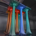 Colorful Art Installation With Flowing Column Structures In Red Orange Green And Blue Hues