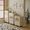 White Dressers With Yellow Arched Details By Window And Plant Paintings On Wall