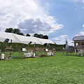 Garden Landscape With Green Lawn Ice Cream Truck White Tents And Outdoor Seating