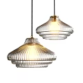 Two Modern Ribbed Clear Glass Pendant Lights Hanging With Warm Glow