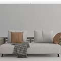 Rattan Frame Outdoor Sofa With White Cushions Brown Pillows And Striped Throw