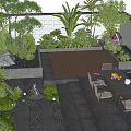 Cozy Courtyard Garden With Wooden Deck Dining Table Chairs Plants Stone Fire Pit And Lighting