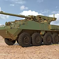 Two Tan And Green Armored Tanks On Sandy Terrain Under Blue Sky White Clouds