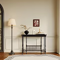 Classic Black Entryway Console Table With Floor Lamp Flowers And Wall Art On Paneled Wall