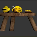 Wooden Round Table With Bright Yellow Origami Shapes And Small Decorative Candle