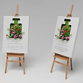 Two Wooden Easels Holding Paintings With Green Bottle Flowers And Proverb Text