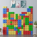 Colorful LEGO Brick Decorative Wall With Framed Artworks And Potted Plants
