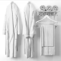 Soft White Textured Bath Towels And Robe Hanging On Rack Against Bricks Wall Bathroom