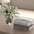 Transparent Vase with White Tulips on Wooden Table and Fashion Books