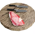 Fresh Raw Beef Steak On Round Wooden Cutting Board With Two Knives