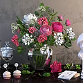 Colorful Floral Arrangement in Glass Vase with Pink Roses White Flowers and White Sculpture