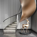Elegant Spiral Staircase With Gold Accents Glass Railing And Golden Deer Sculpture
