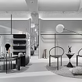 Modern Clothing Store Interior With White Garments And Black Counter Display Racks