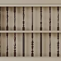 Decorative Wooden Balusters With Various Intricate Designs Displayed On Two Shelves