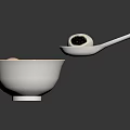 Traditional Chinese Tangyuan in White Bowl with Soup Pink White and Black Balls and Spoon