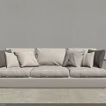 Cozy Beige Three Seater Sofa with Dark Cushions and Floor Lamp in Light Room