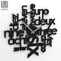 Umbra Stylish Modern Black Wall Clock With Multilingual Number Words Design