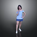 Woman Posing in Blue Off Shoulder Top Blue Shorts and White Shoes Against Gray Background