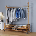 Golden Metal Clothing Rack With Hanging Shirts Jeans Folded Clothes And Shoes In Bedroom