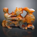 Ancient Carved Sculpture With Human Figure And Mythical Beast Orange Gray Intricate Patterns
