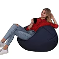 Woman Sitting On Blue Bean Bag Chair In Red Top Ripped Jeans Holding Black Cup