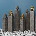 Decorative Stone Pillars With Gold And Gray Lion Statues In Blue Background On White Pebbles