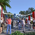 Media Event With People Photographers Red Curtains White Curved Structures Palm Trees And Green Plants