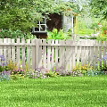 Beautiful Garden Yard With White Picket Fence Lush Green Lawn And Colorful Flowers