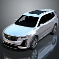 Silver Cadillac SUV With Black Roof And Sleek Modern Exterior Design